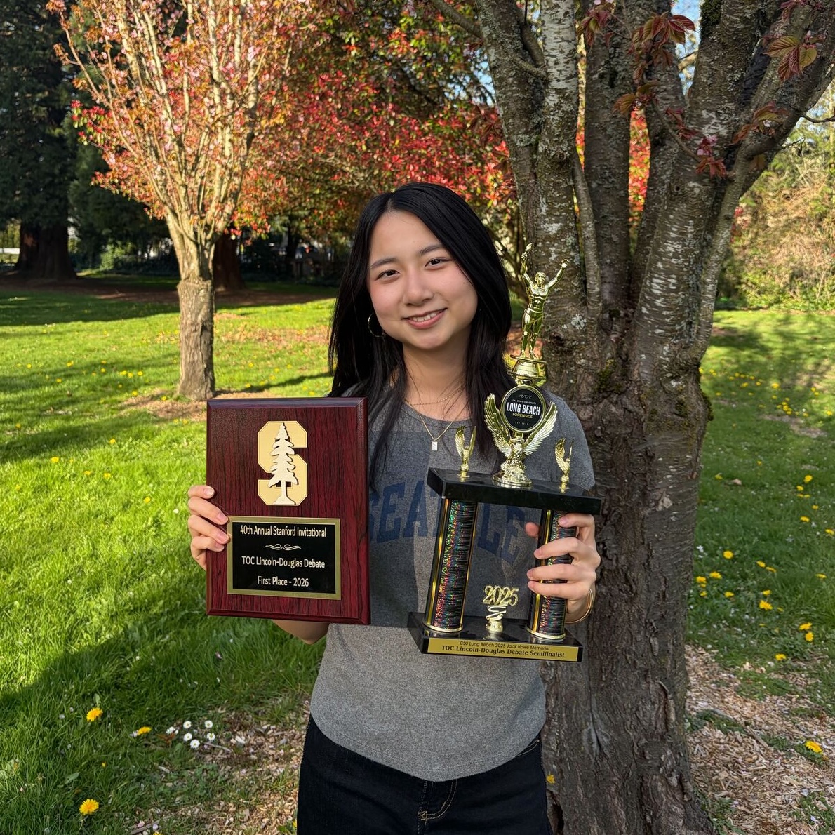 Shiwen Huang with Stanford trophies